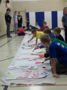 Conquest St. Mary’s Ohio group painting their shields