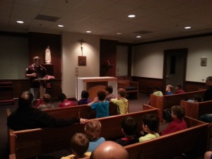 Jacob Harrison giving a talk in the Northwoods school chapel.